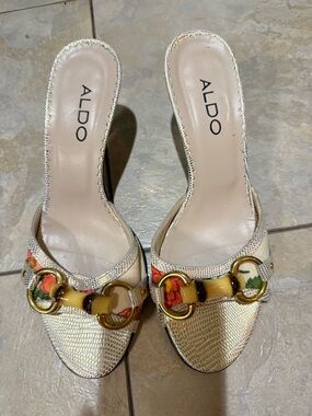 Aldo Metallic Gold Slide Mules with Floral and Yellow Accent